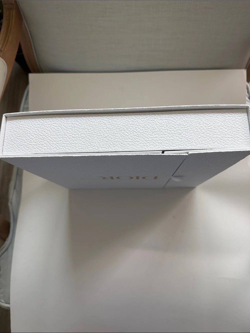 A Large Textured Christian Dior Gold Logo Gift Box With Ribbon Side Closure